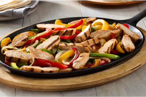 Grilled fajitas with onion, green, yellow and red bell peppers 