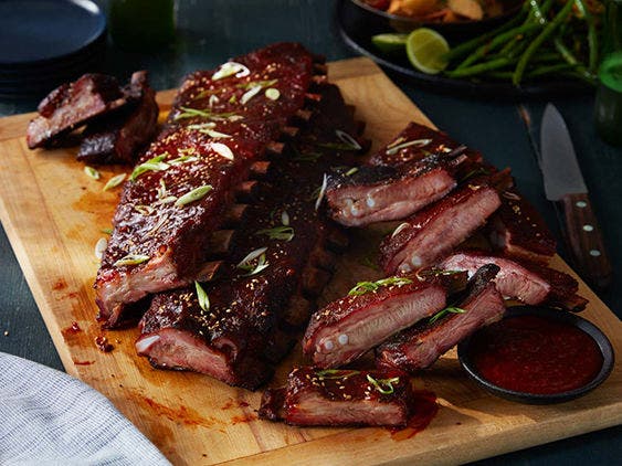 Image of Gochujang Glazed St. Louis-Style Ribs Recipe on a cutting board.