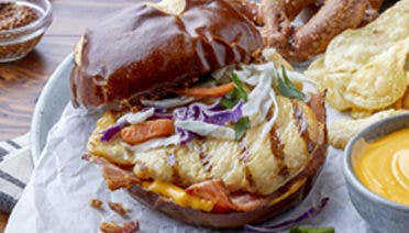 Grilled chicken sandwich with slaw on a brown bun
