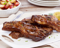 Country style ribs plated on a white plate