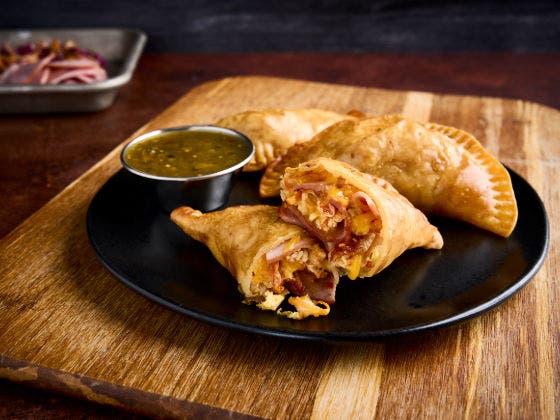 Korean Empanada served on a dark plate.