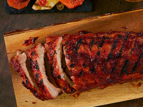 Image of baby back ribs on a cutting board.