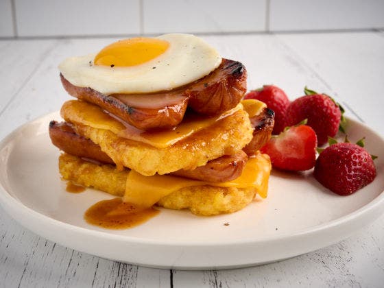 Hashbrown Stacker With a Side of Strawberries on a Plate