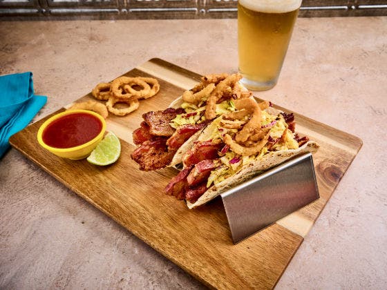 Kansas City Big Bacon BBQ Tacos on a cutting board.