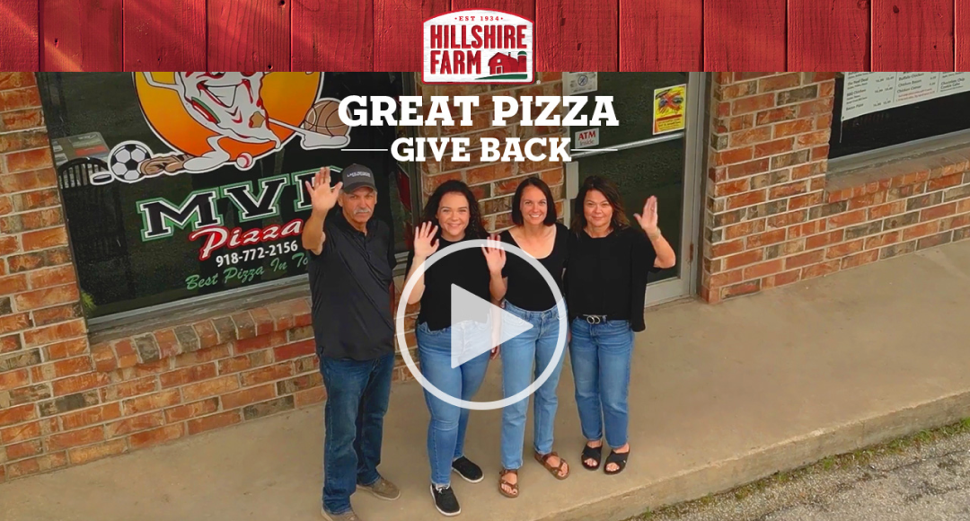 MVP Pizza Owners and employees, waving at a drone 