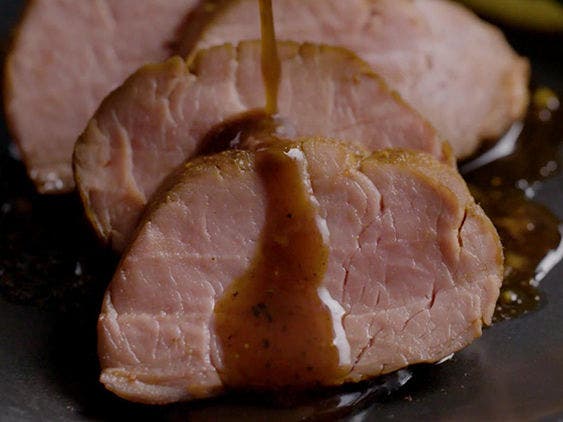 Pan Seared and Sliced Glazed Pork Tenderloin on a Plate.