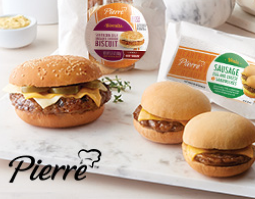 Three unpackaged burgers plated on a white board