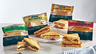 Four individual packaged sandwich melts image