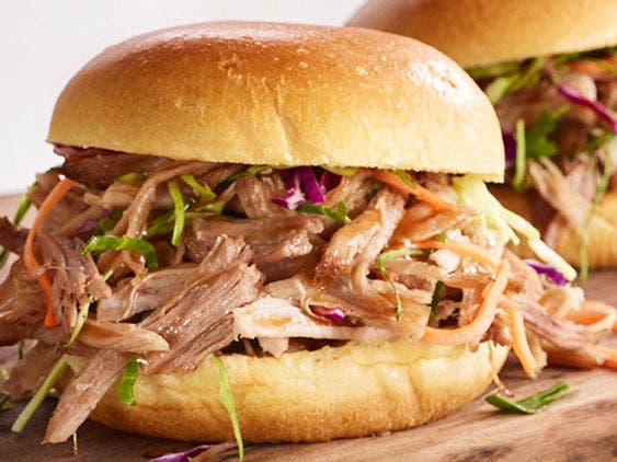 Pulled pork on a bun with colorful slaw.