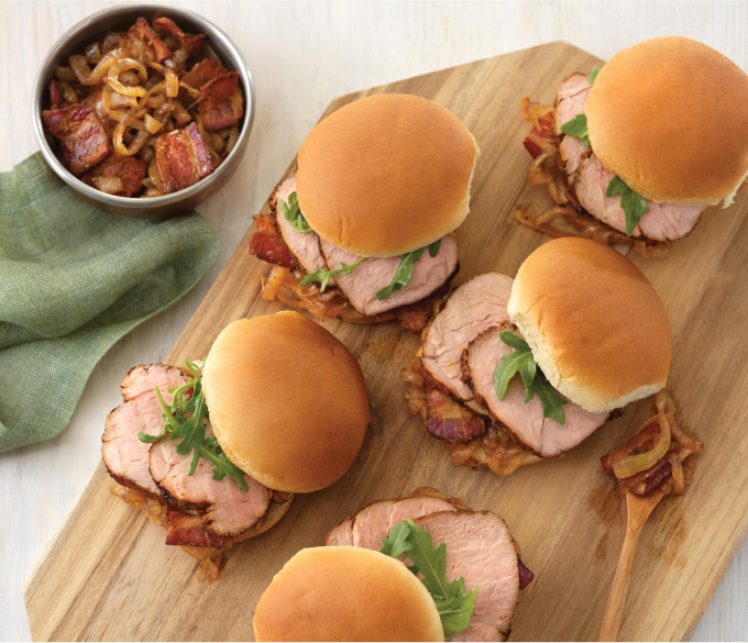 Pork Sliders with a side on a white plate