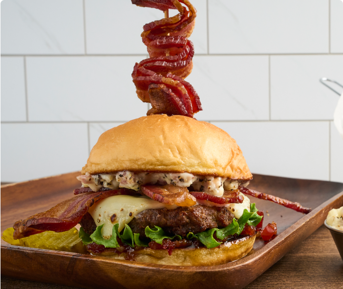 Big-Big Bacon Burger on a wood plate