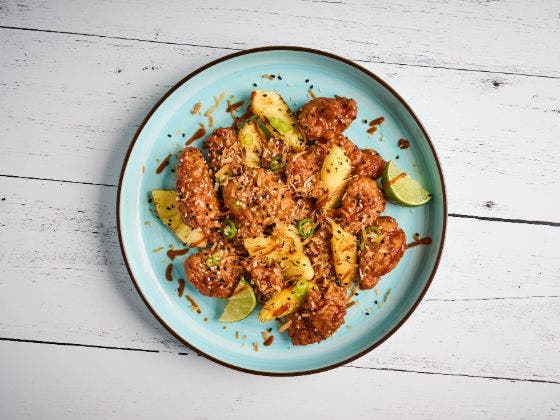 Swicy Island Boneless Wings Recipe on a blue plate.